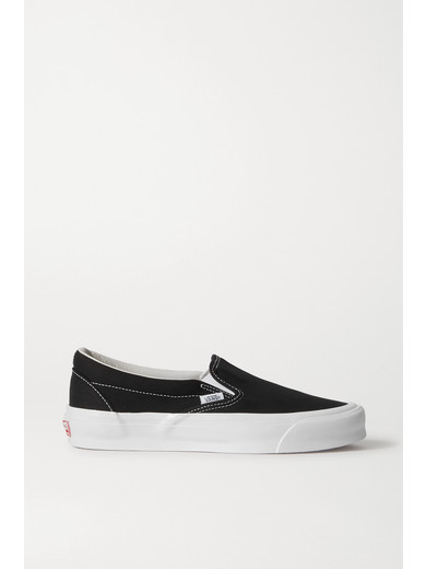 white canvas slip on vans
